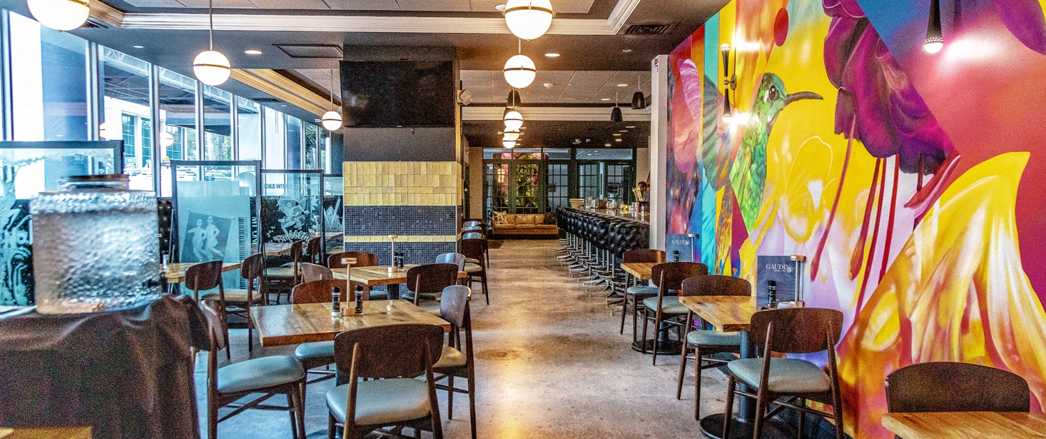 gaudin restaurant entry from lobby, colorful wall mural