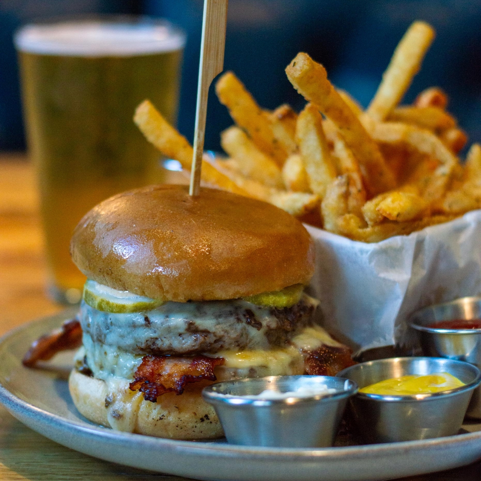 le gaudin double burger, fries, and a cold beer