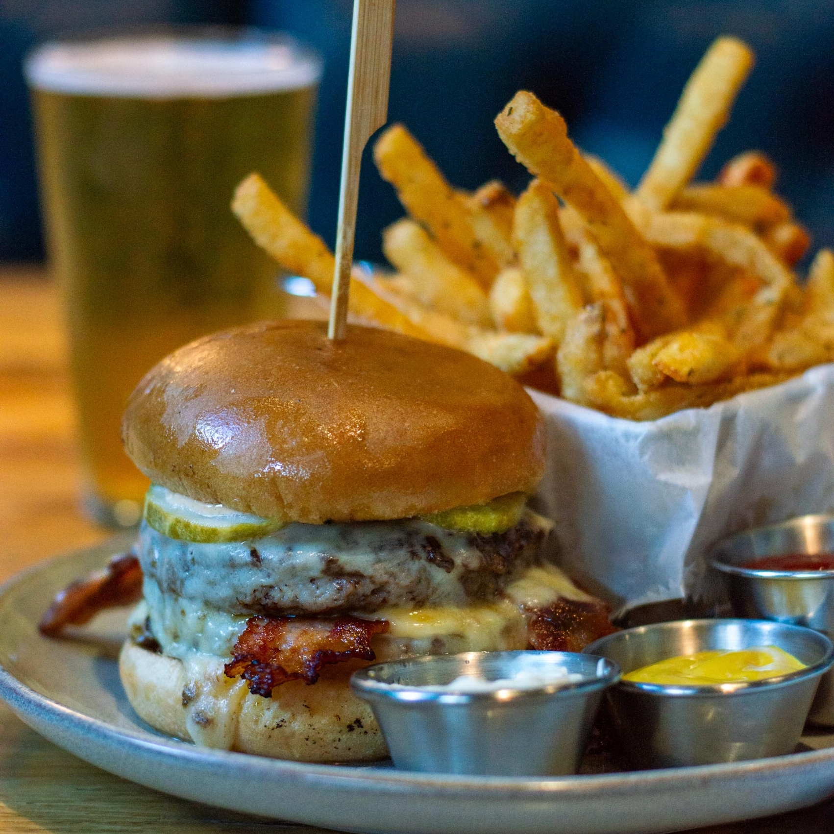 le gaudin double burger, fries, and a cold beer